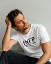 product-photo--a-man-wearing-a-white-t-shirt-looks.webp